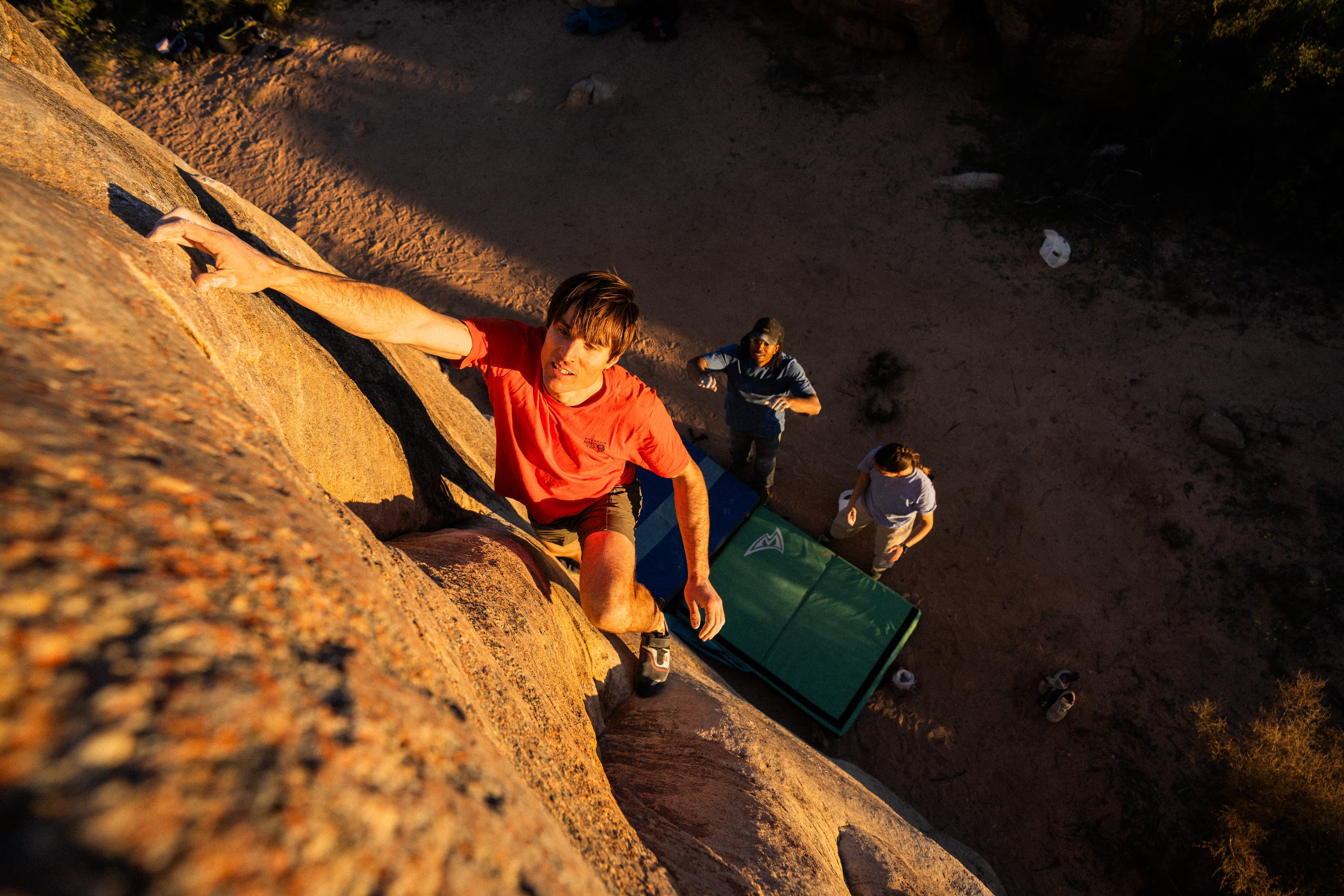 Ethan Pringle climbing slab at sunset in Rocklands spotted by Kyra Condie and Caleb Robinson